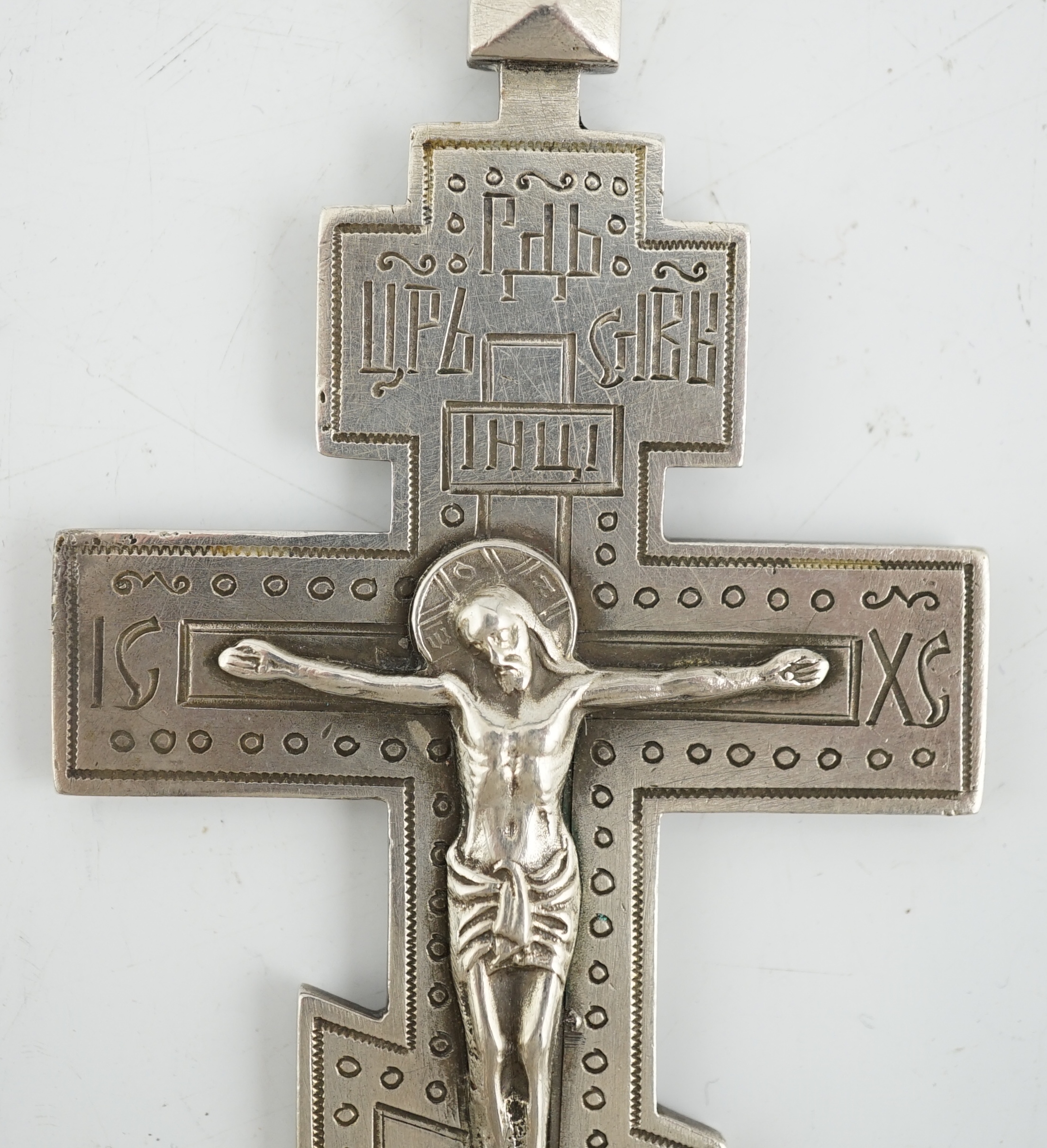 A late 19th century Russian 84 zolotnik silver crucifix, assay master Lev Oleks, Moscow, 1896, engraved with Cyrillic script